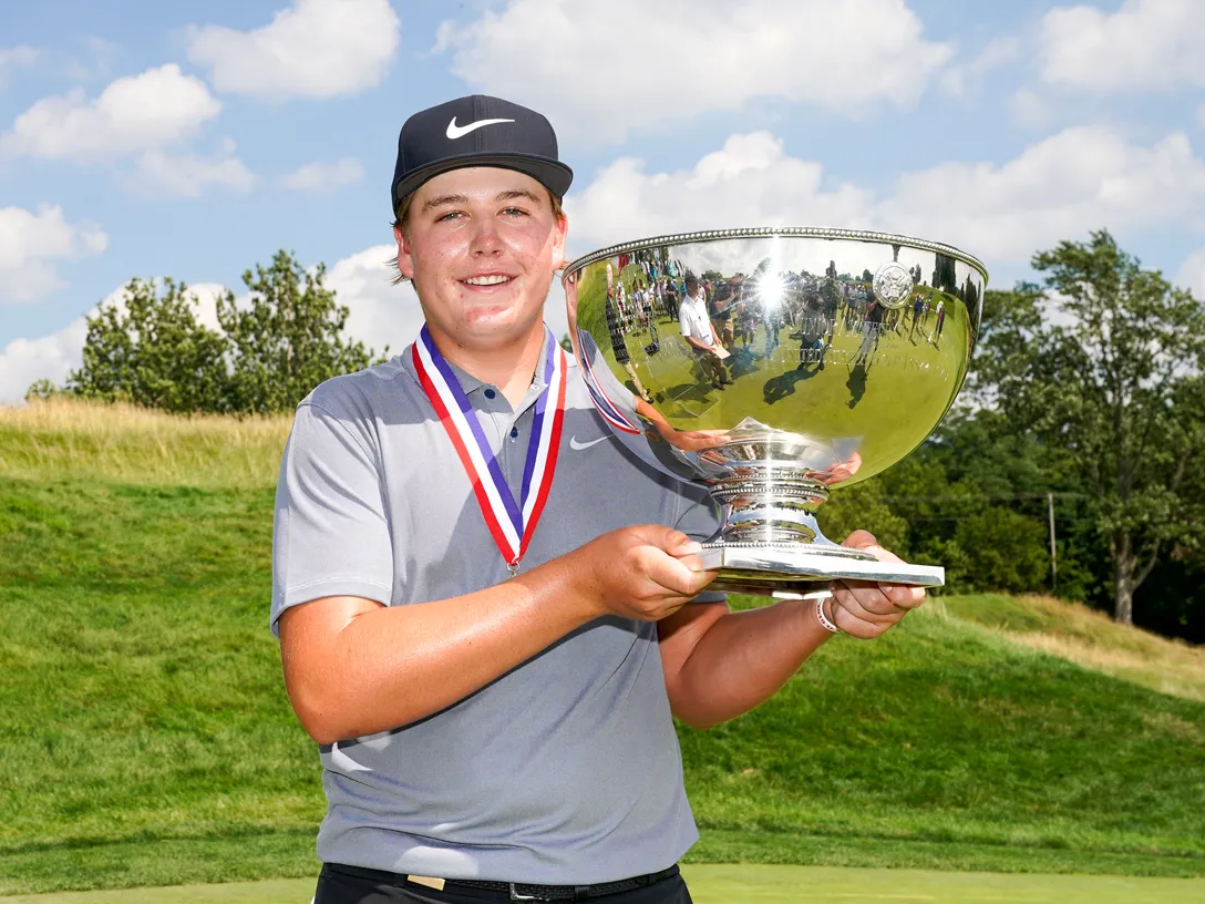 golfer with trophy