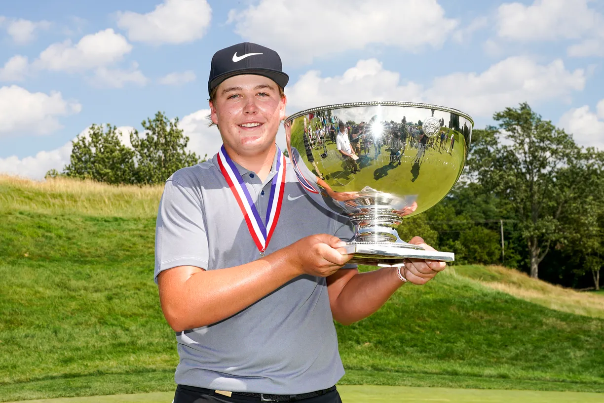 golfer with trophy