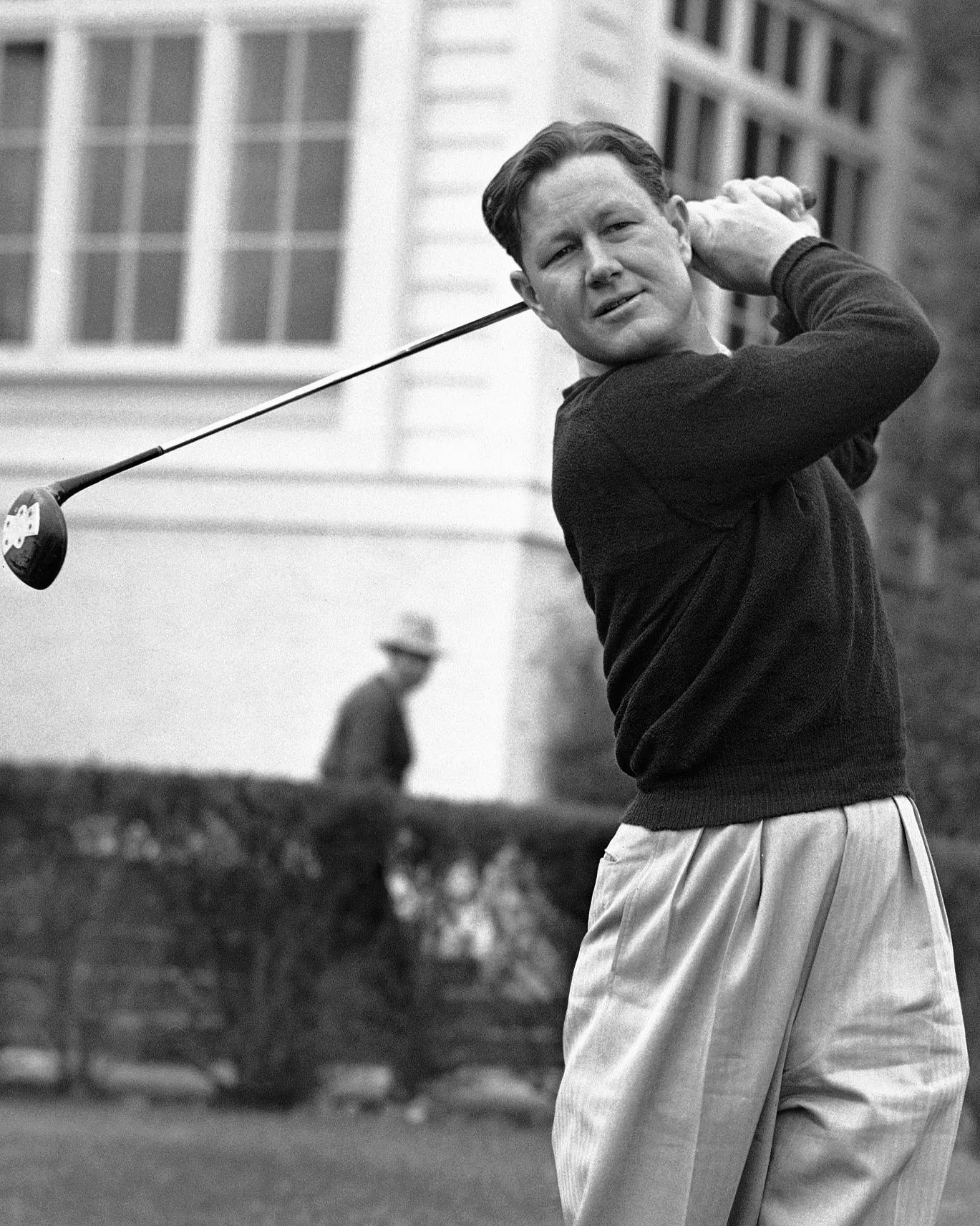 man swinging a golf club