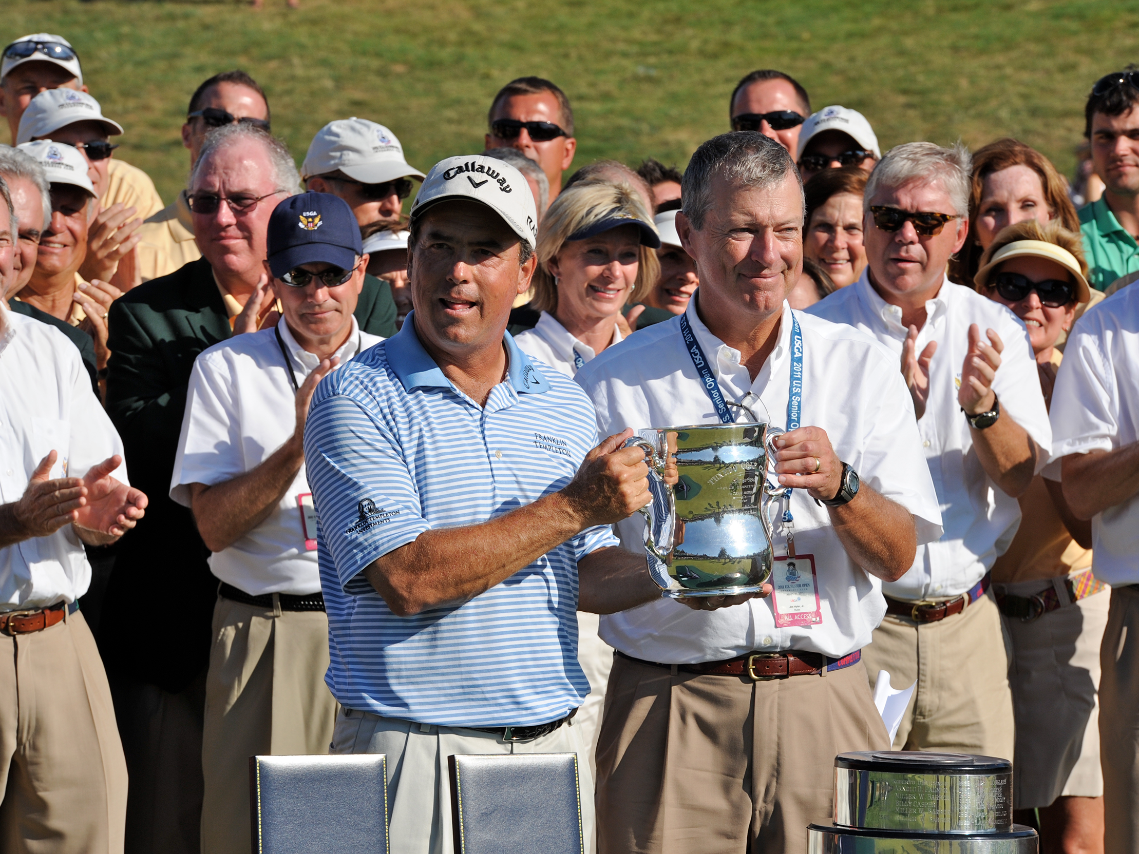 golfer holding trophy