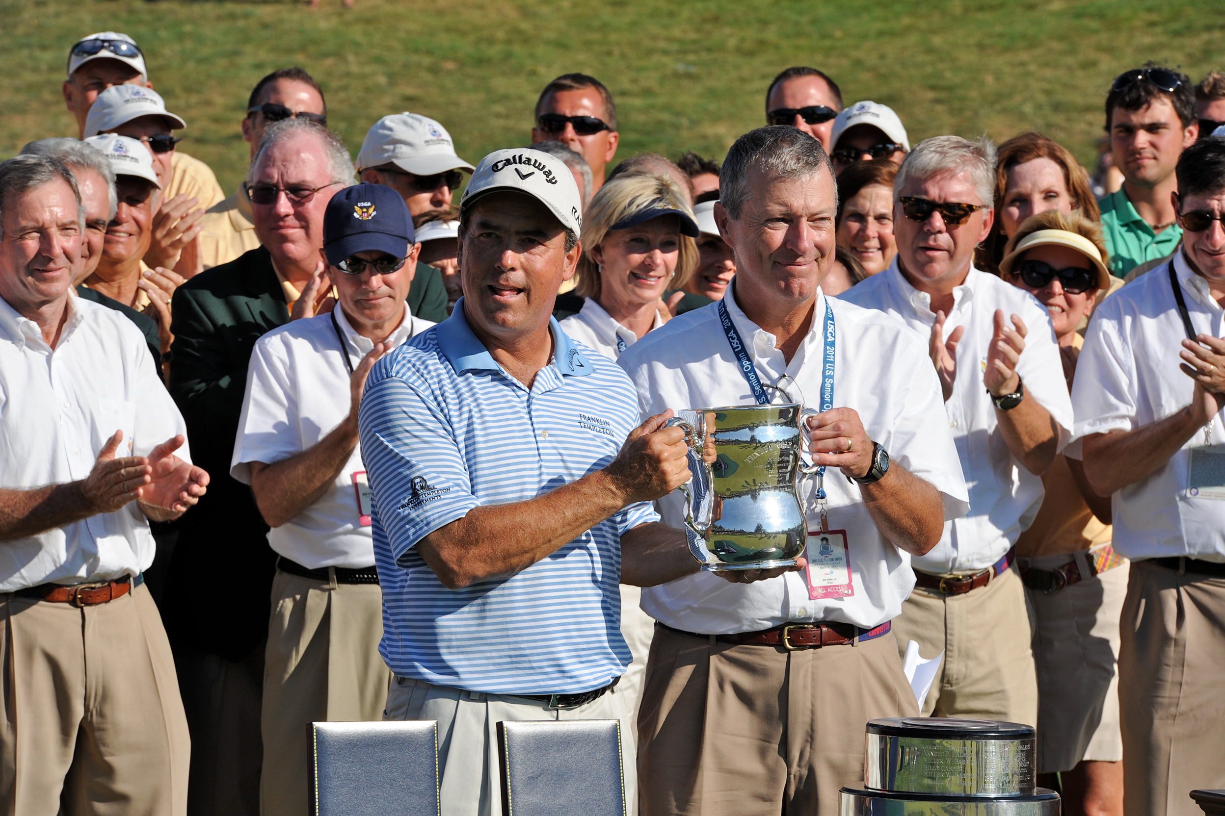 golfer holding trophy
